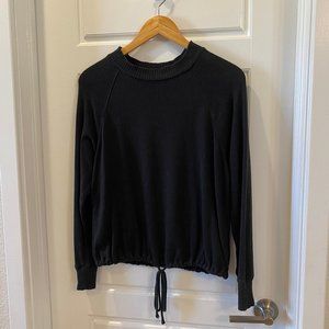 Black long-sleeve pullover with drawstring hem, in size XS, a new day